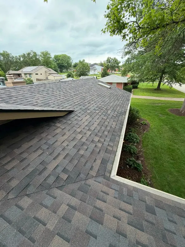 Weathered wood shingles and a new gutter line