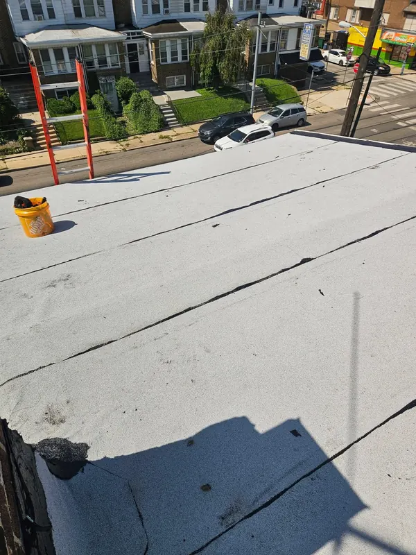 Flat roof replacement between parapet walls