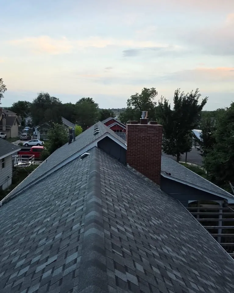 Chimney flashing repair on a Brooklyn shingle roof
